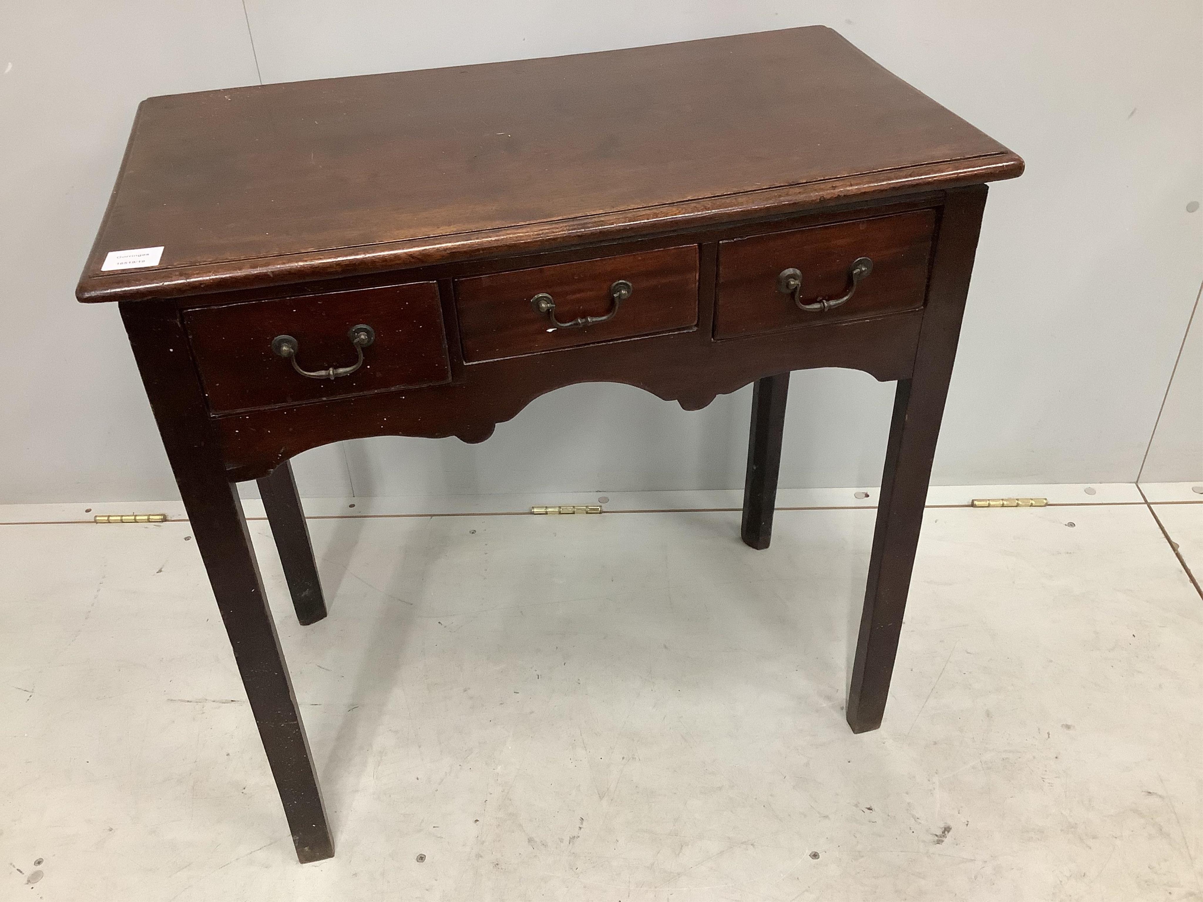 A George III rectangular mahogany three drawer side table, width 74cm, depth 41cm, height 73cm. Condition - fair